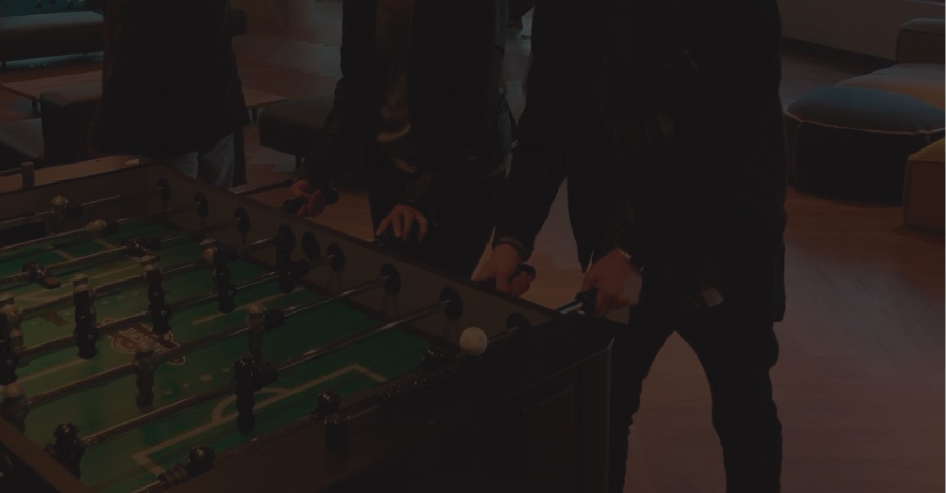 People playing foosball
